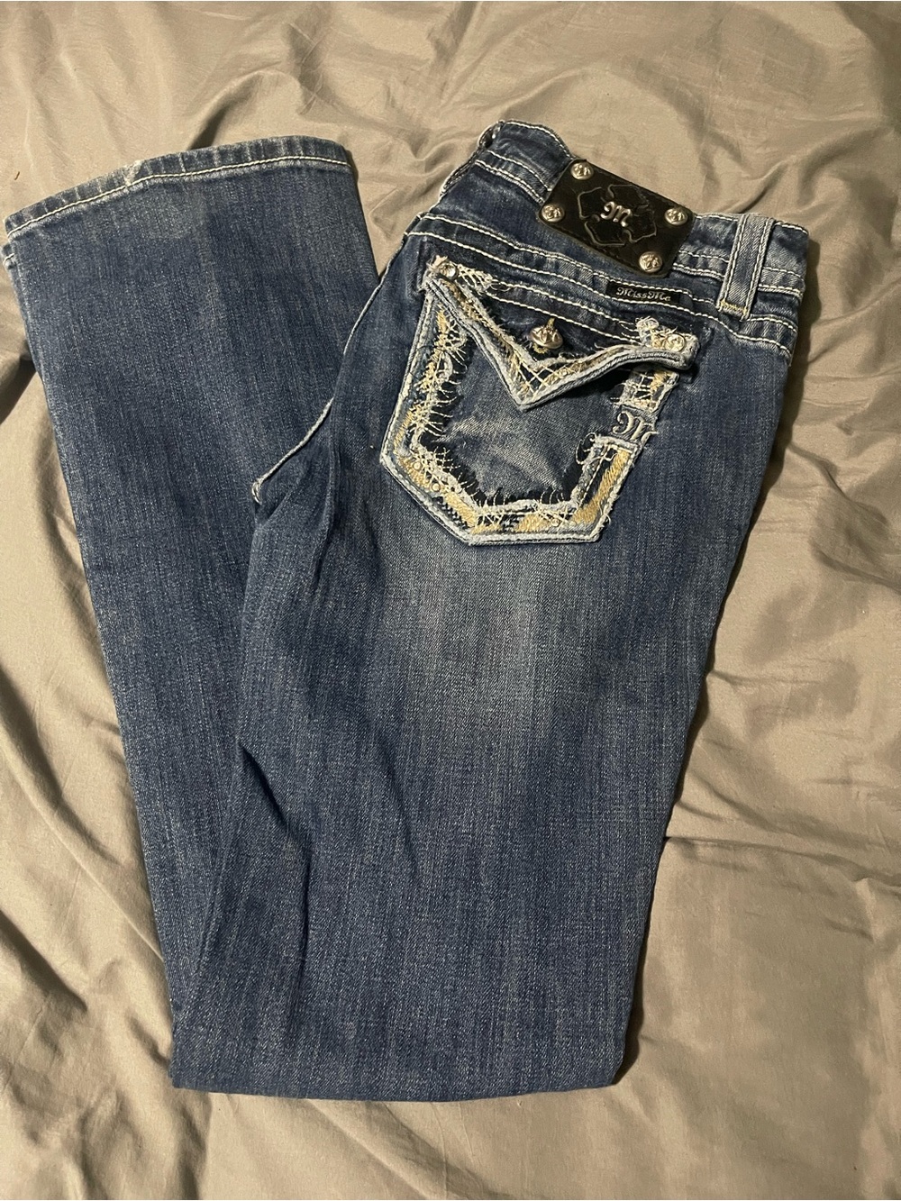 Women’s Distressed Dark Blue Denim Jeans with Embellished Pocket